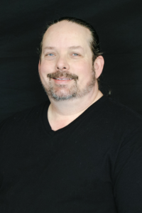 Headshot of Adam Basich, Lead Designer at PlayCreation