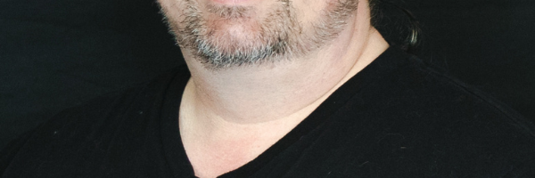 Headshot of Adam Basich, Lead Designer at PlayCreation
